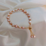 Pulseira de pérolas rosa em ouro