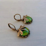 Brincos esféricos com um ourives em ouro antigo